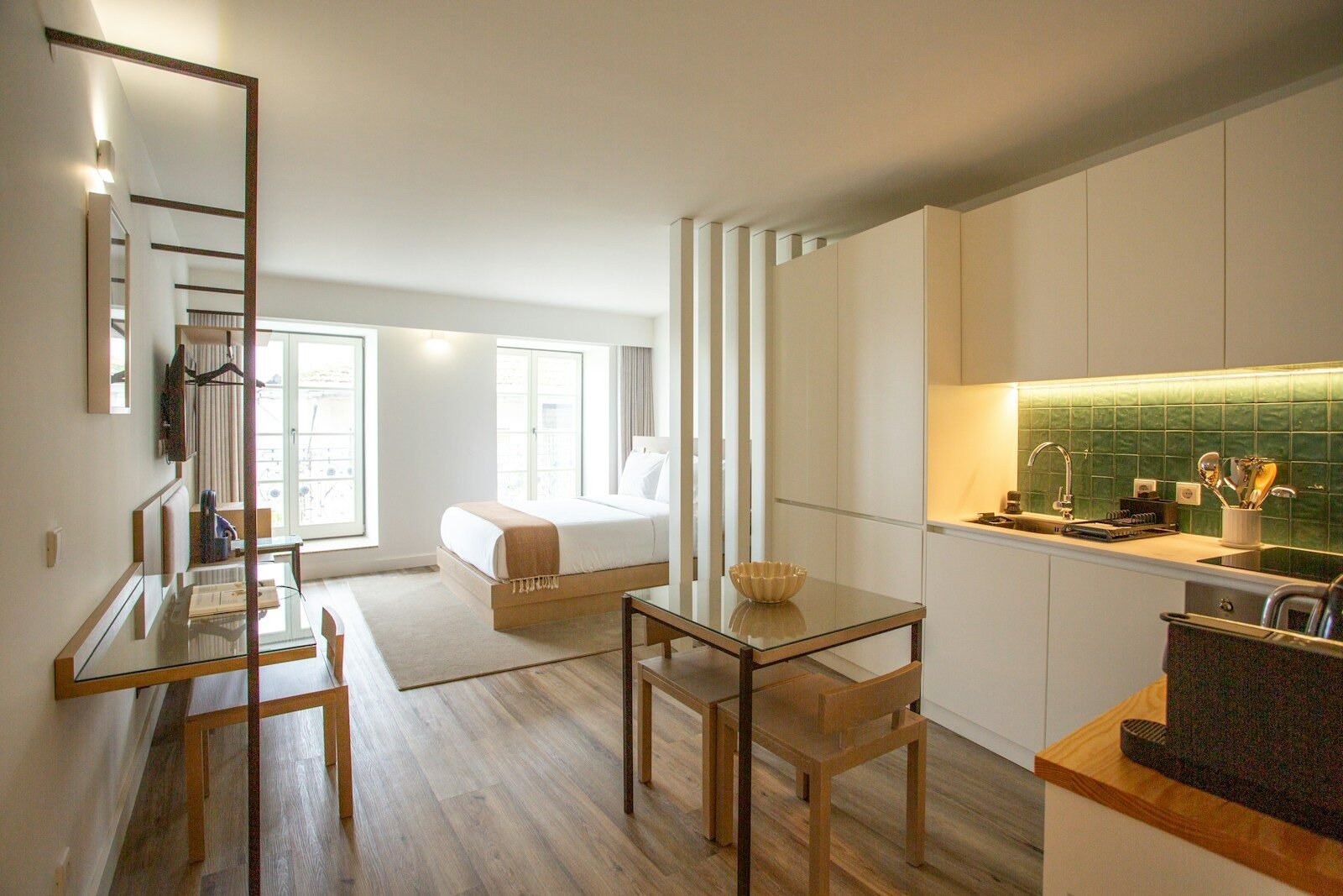 a kitchen with a table and chairs in it
